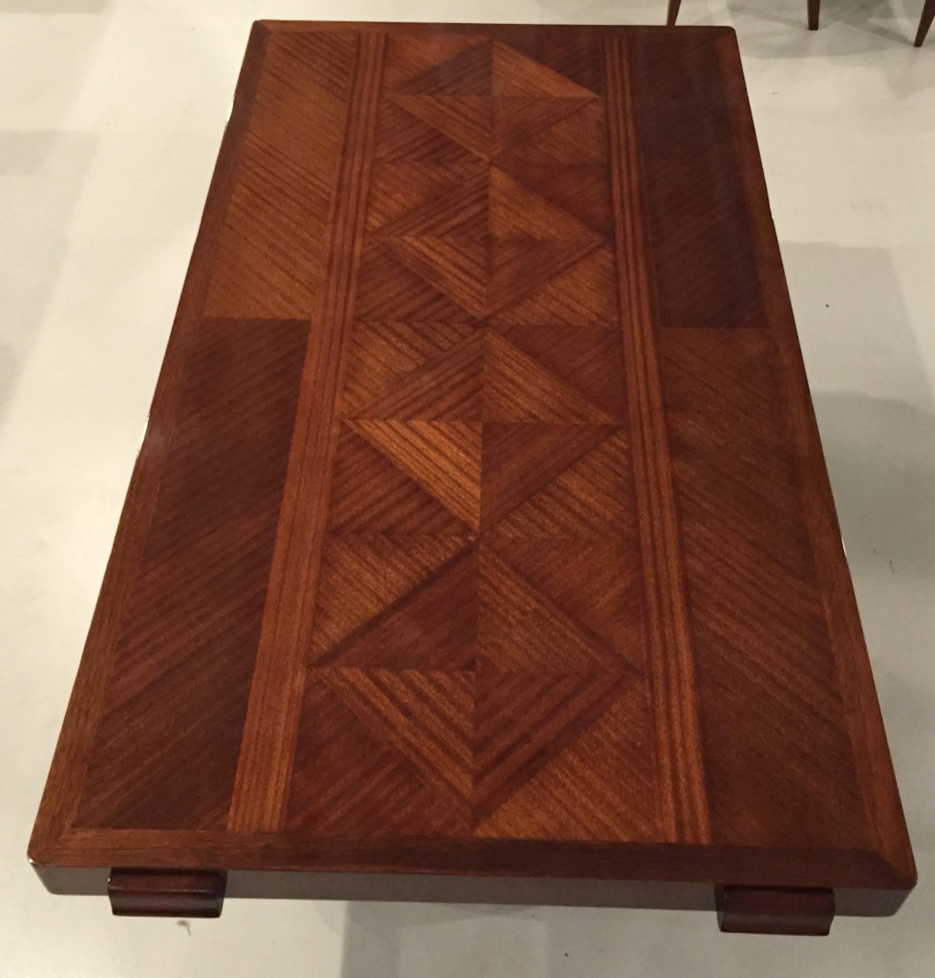 Stunning French Art Deco masterpiece dining table is by designer Gaston Poisson.  The solid mahogany wood is breathtaking with legs that coordinate  with a matching buffet. Incredible inlay top. Beautiful French finish. 