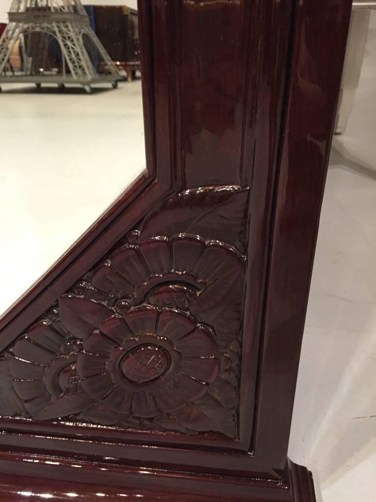 This beautiful French Art Deco mirror can either be freestanding or hung on the wall. With flower motif in the bottom right and left corners. The wood has been professionally refinished. 

circa 1940s.