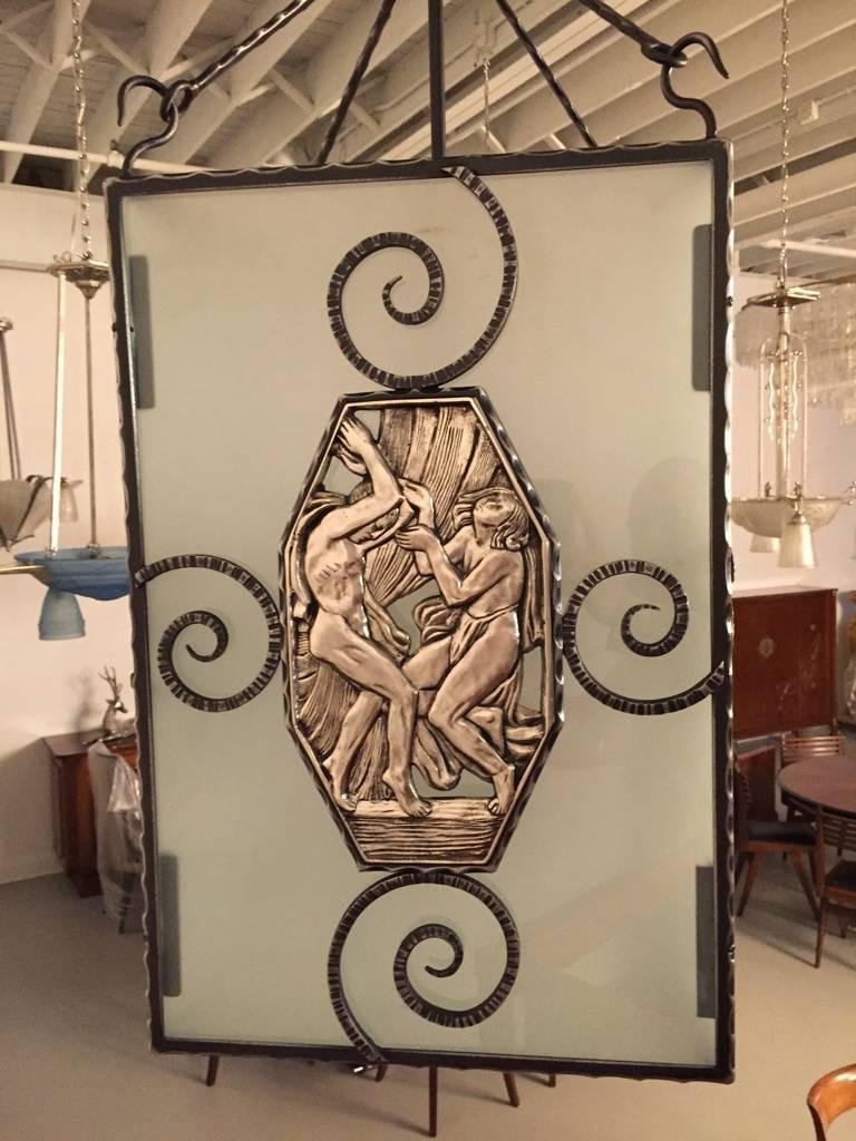 Stunning French Art Deco nickel over bronze and iron lantern. The frame having figural bronze panels depicting mythical scenes. Height can be adjusted upon request. 