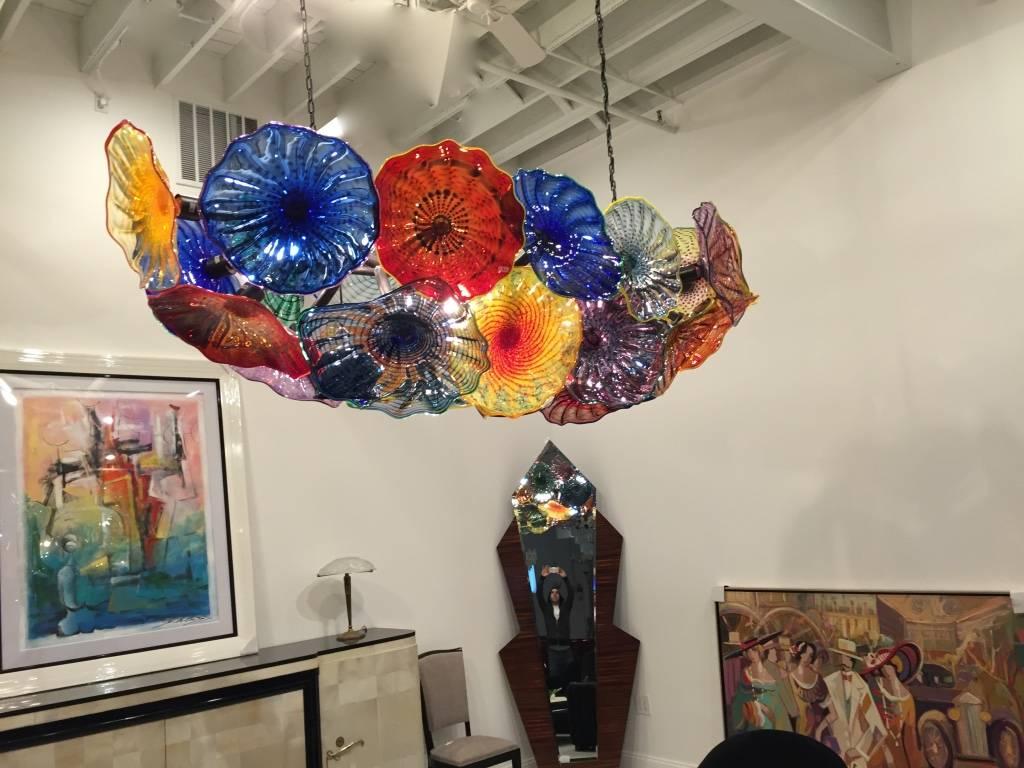 This Gorgeous handblown glass chandelier is incredible. Each piece of glass is handblown. Stunning pieces of glass called platters, one is nicer then the next. 



 