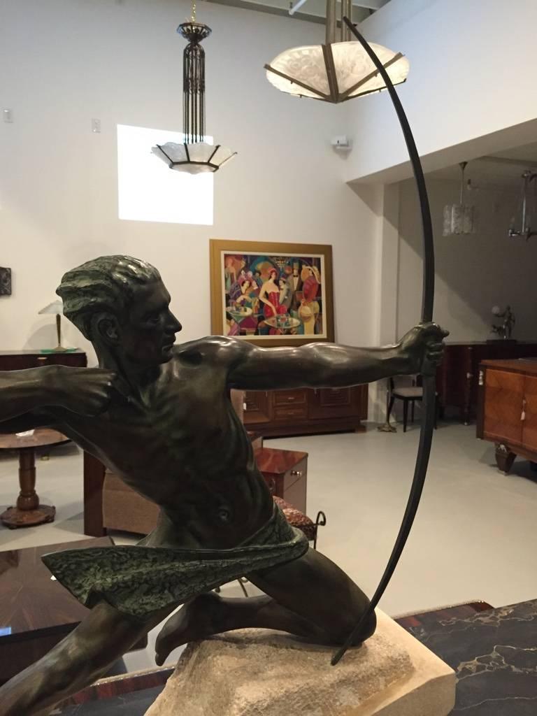 Amazing French Art Deco archer bronze signed by Max Le Verrier (1891-1973). Incredible bronze detailed sculpture with green patina on granite base. Signed on the base: M. Le Verrier.