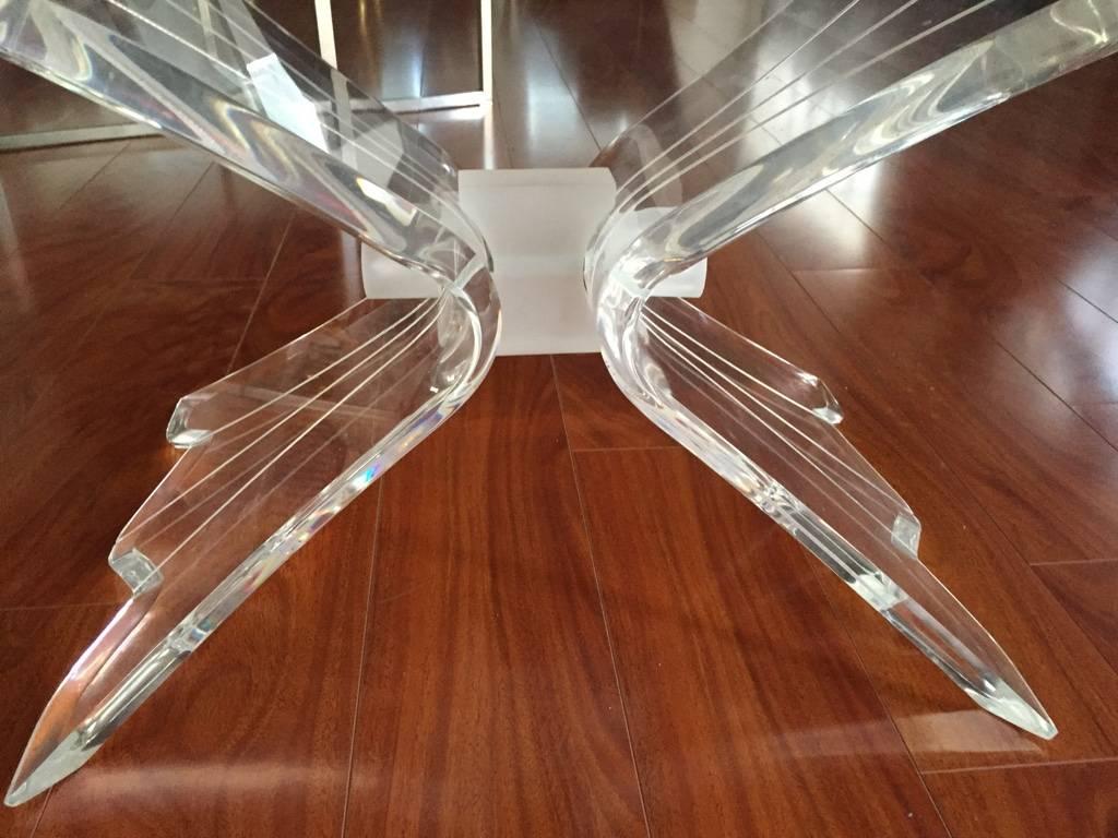 Mid-Century Modern coffee table with Lucite base and glass top. Beautiful Lucite base with very stylish legs. With beveled glass in an oval shape.