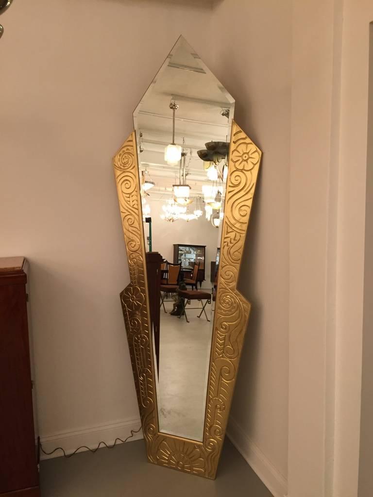 Stunning French Art Deco gilt wood mirror. Having incredible geometric and deco details carved into the wood. This mirror makes a great focal point of any room. Full length Mirror. 