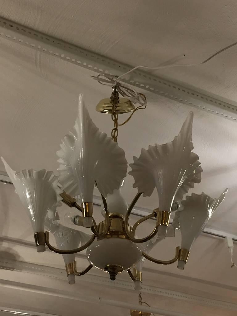 Mid-Century Modern Murano chandelier with six handblown glass white flower petals. Having a brass and white glass frame.