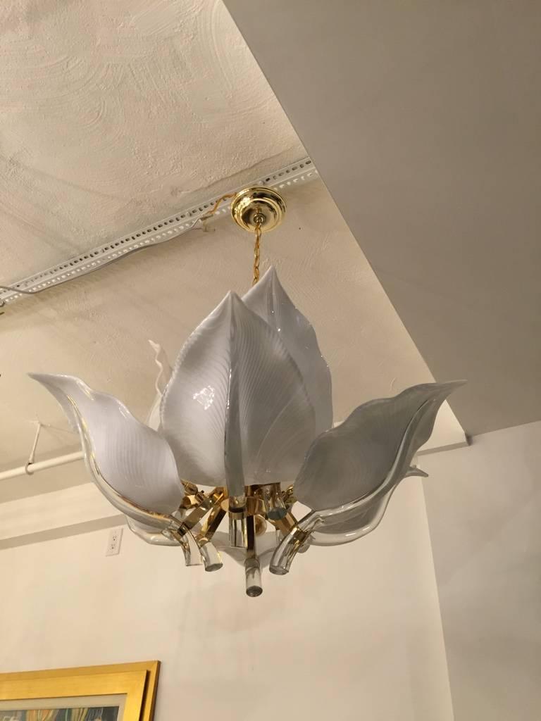 Stunning Italian Mid-Century Modern Murano two-tier glass leaf chandelier with brass armature. Having nine white handblown Calla Lilies. Any amount of chain can be added for custom hanging length. 

Height with out chain 23 inches.