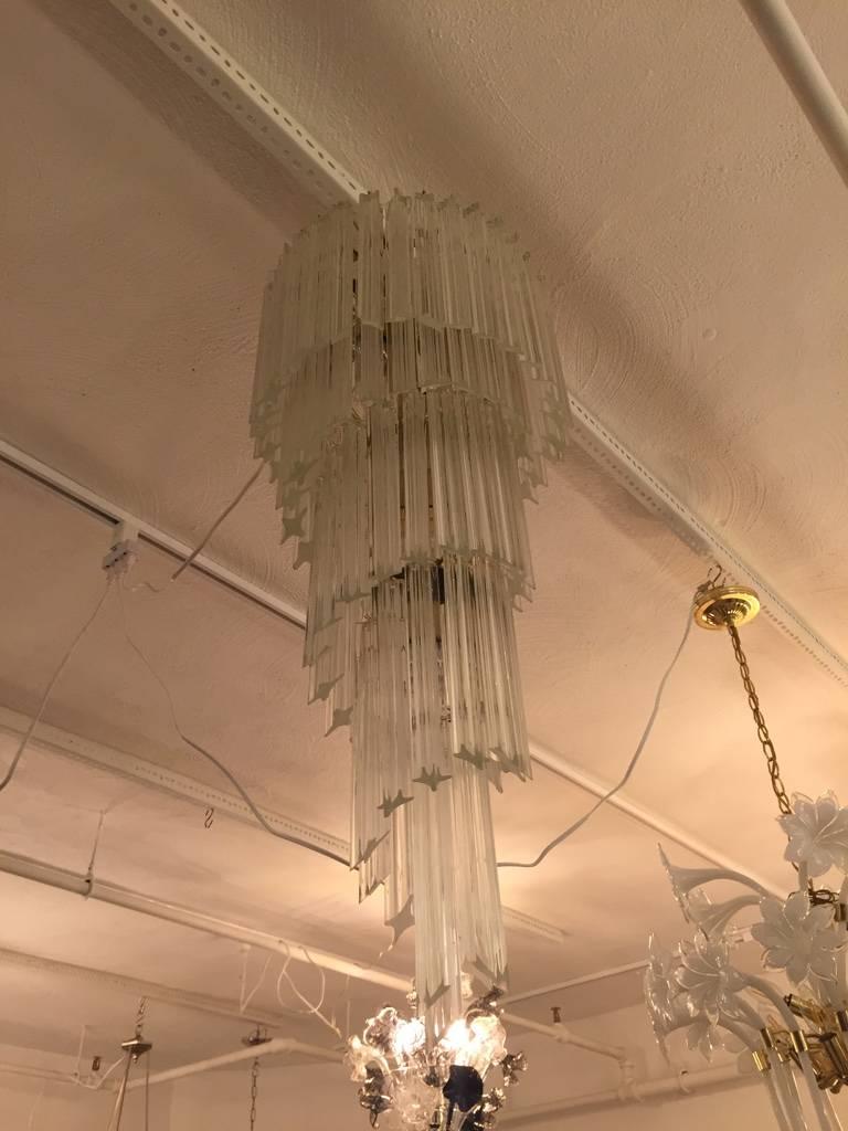Mid-Century Modern Italian spiral chandelier by Venini. Each of the prisms are solid glass, measuring 10 inches each. They hang from hooks onto a spiral nickel frame, as pictured. Any amount of chain can be added for custom hanging length of the