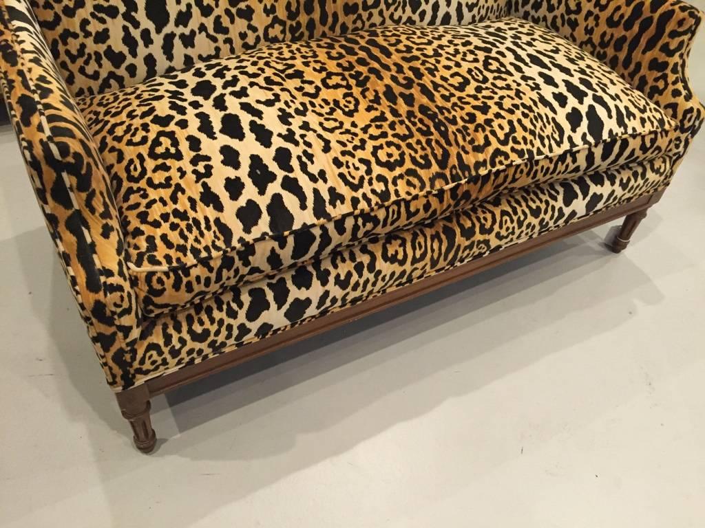 Mid-Century Modern sofa re-upholstered in leopard print. Very comfy.