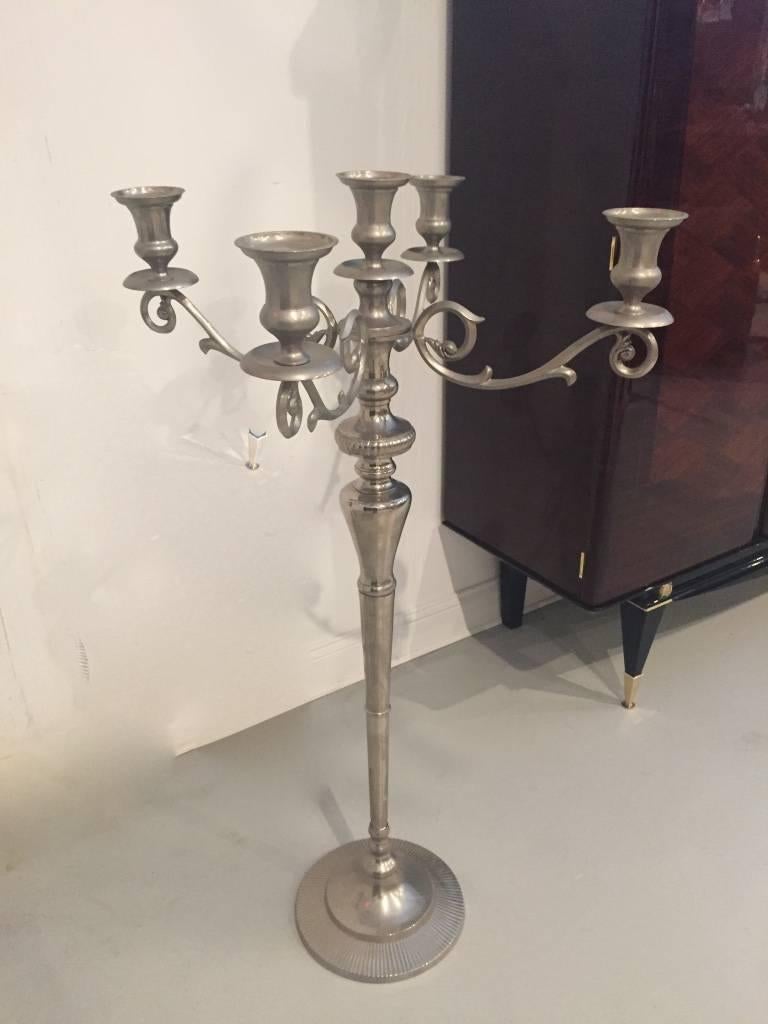 Stunning pair of metal standing candlestick holders. With ornate details and very stylish base.