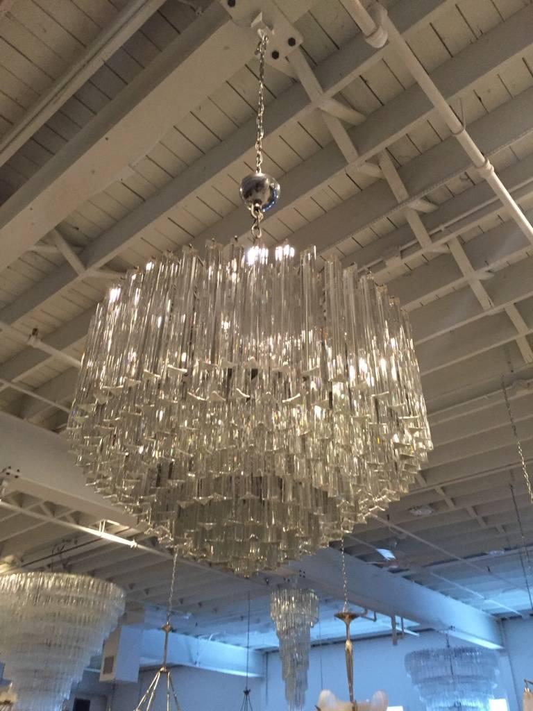 Stunning Mid Century Modern Italian round chandelier by Venini. Each of the prisms are solid glass, measuring 11 and 4 inches. They hang from hooks on a nickel frame, as pictured. Any amount of chain or rod can be added for custom hanging length of
