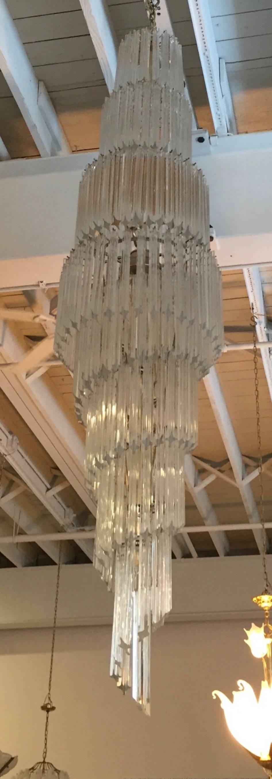 Monumental Mid-Century Modern Italian spiral chandelier by Camer. Each of the prisms is solid glass, measuring 11 inches each. They hang from hooks onto a spiral brass frame, as pictured. Any amount of chain can be added for custom hanging length of