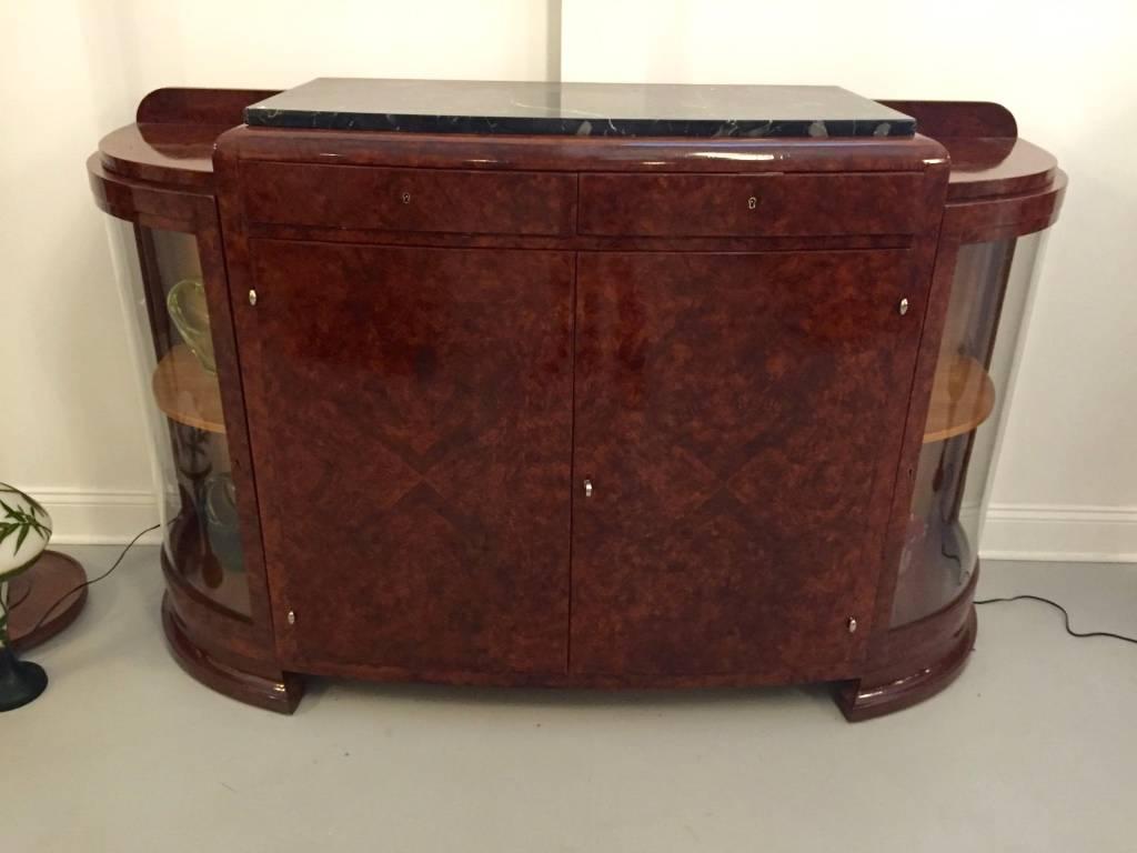Stunning French Art Deco burl Amboyna buffet with Portoro marble top. Having two central doors flanked by glass doors. Plenty of space for storage and display. With beautiful deco legs and details.
