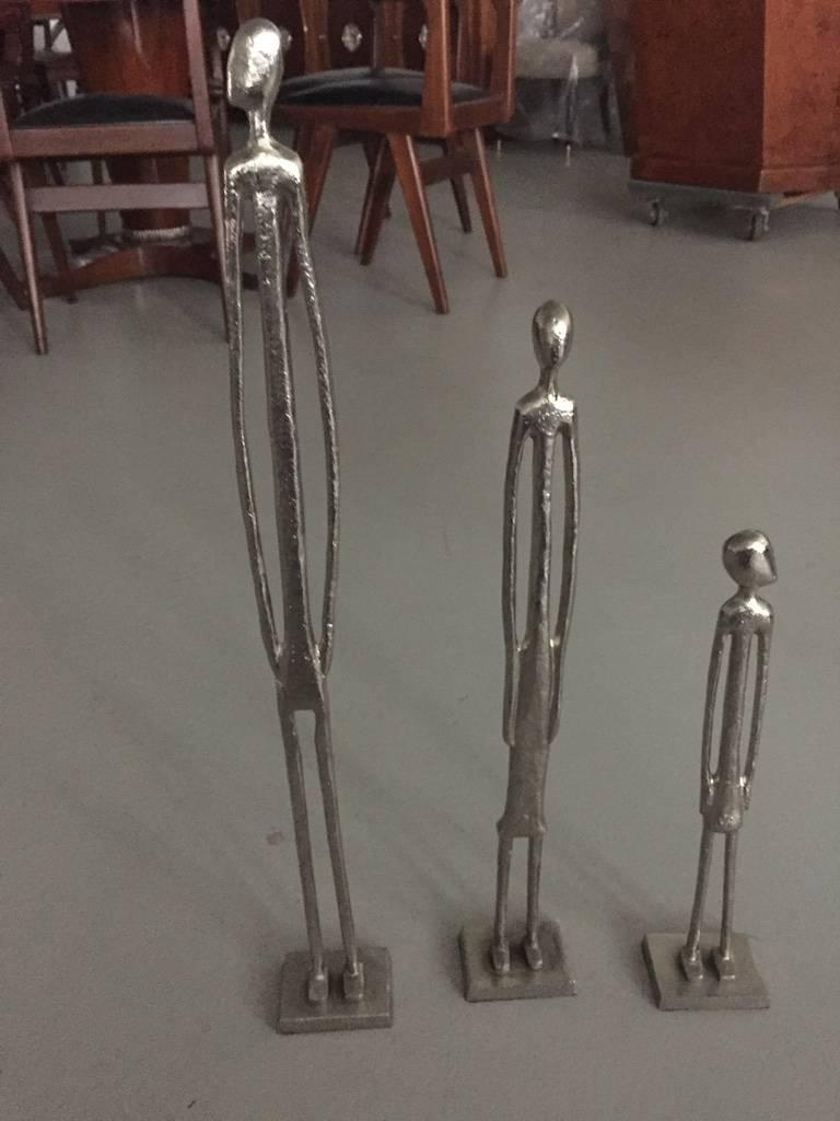 Stunning set of three silver plated figures. One taller than the other. Very cute