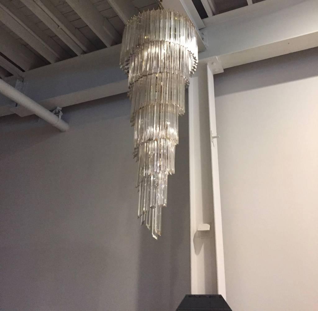 Stunning Mid-Century Modern Italian spiral chandelier by Venini. Each of the prisms are solid glass. They hang from hooks onto a spiral brass frame, as pictured. Any amount of chain can be added for custom hanging length of the chandelier.