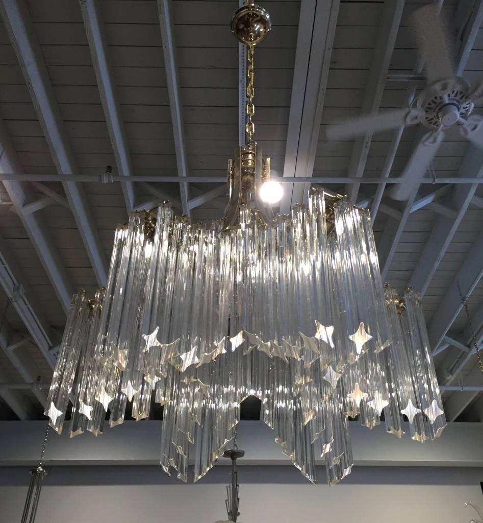 Stunning Mid-Century Modern Italian six-arm chandelier by Camer. Each of the prisms are solid glass measuring 11 inches each. They hang from hooks onto a brass frame, as pictured. Any amount of chain can be added for custom hanging length of the