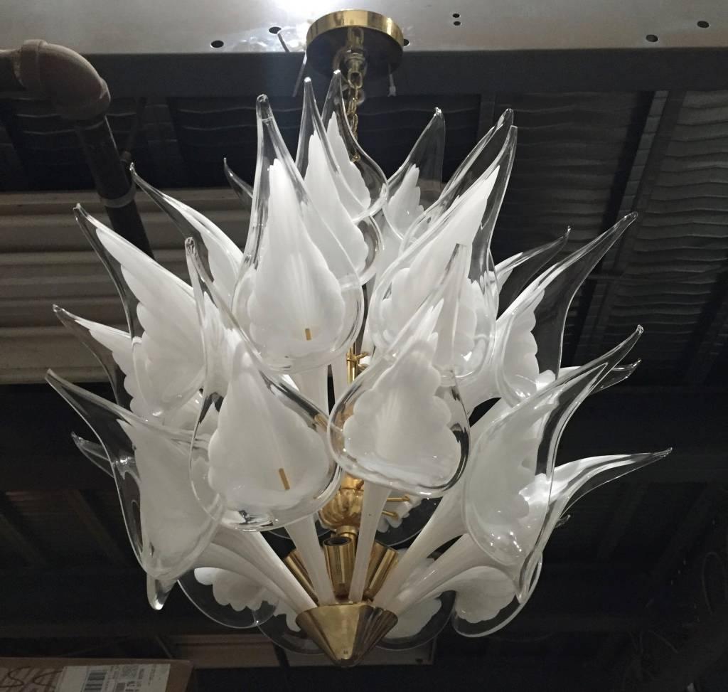 Stunning Italian Mid-Century Modern calla lily flower chandelier by Camer. This high quality fixture has lily shaped pieces of handblown white and clear glass that are installed on a brass frame. The original ceiling plate is included. 

Height