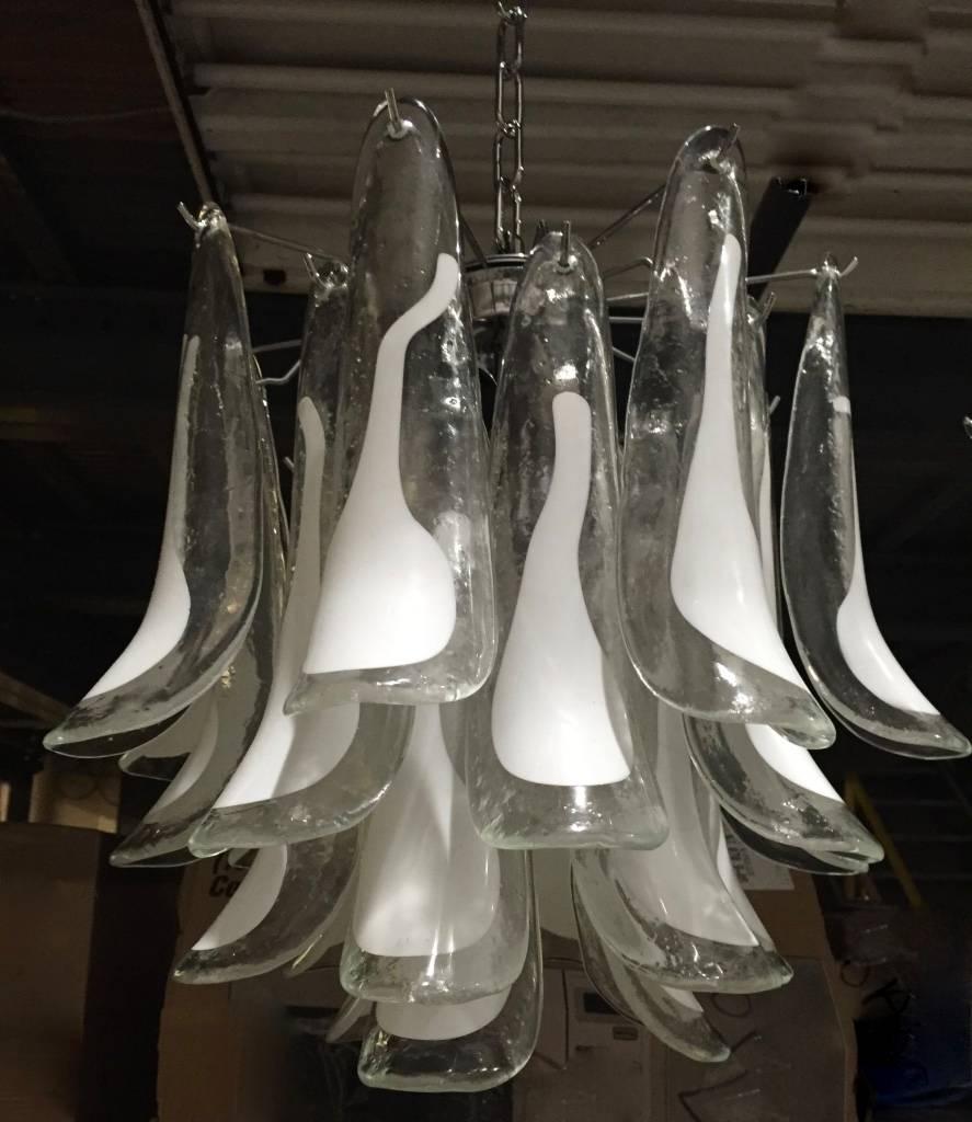 Stunning Italian Mid-Century feather glass chandelier by Mazzega. Having layers of handblown clear and white opaque petals hanging on a chrome frame. Original ceiling plate included. Any amount of chain can be used for custom hanging length.