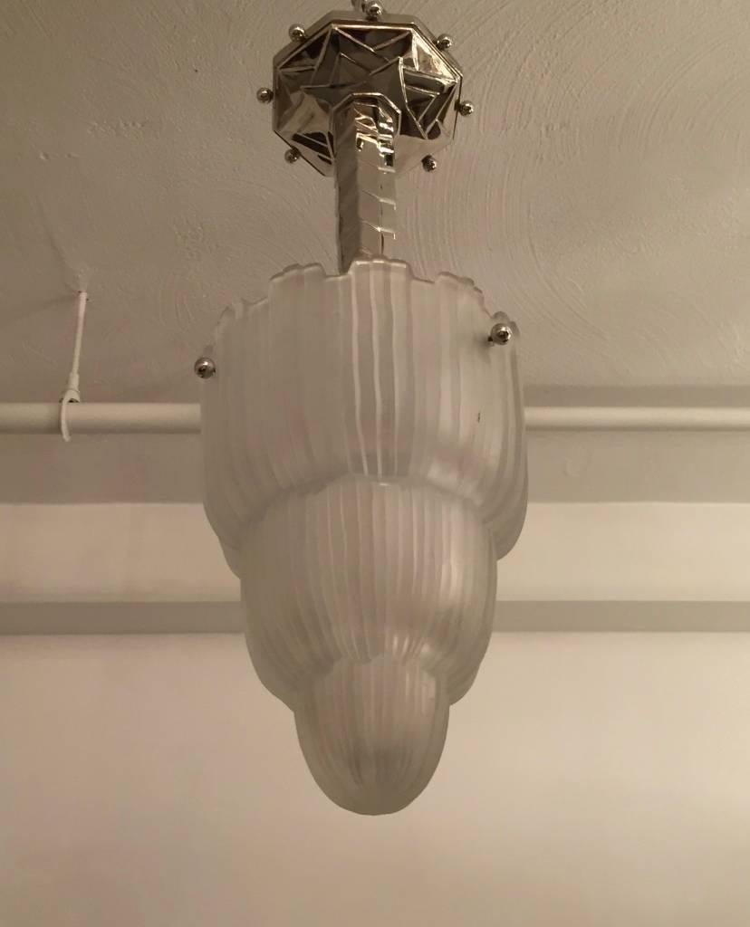 Stunning Art Deco chandelier created by French artist Marius Ernest Sabino in the 1930s. This shade is known as the 