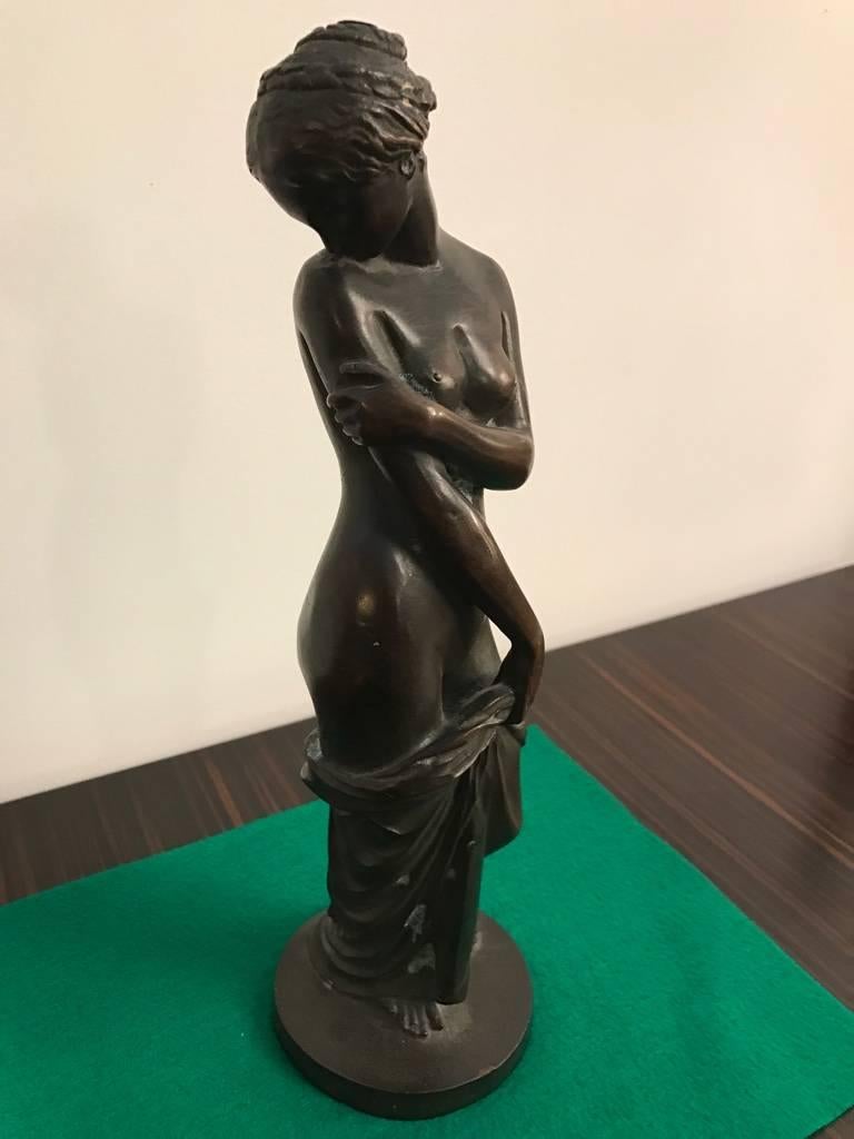 Bronze sculpture of standing nude female. Having beautiful patina on parts of the sculpture.