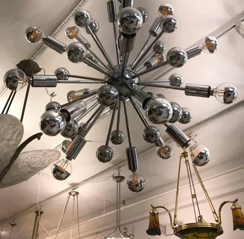 Mid Century Modern chrome Sputnik chandelier. Any amount of chain can be added for custom hanging length. 

Height without chain 18 inches .