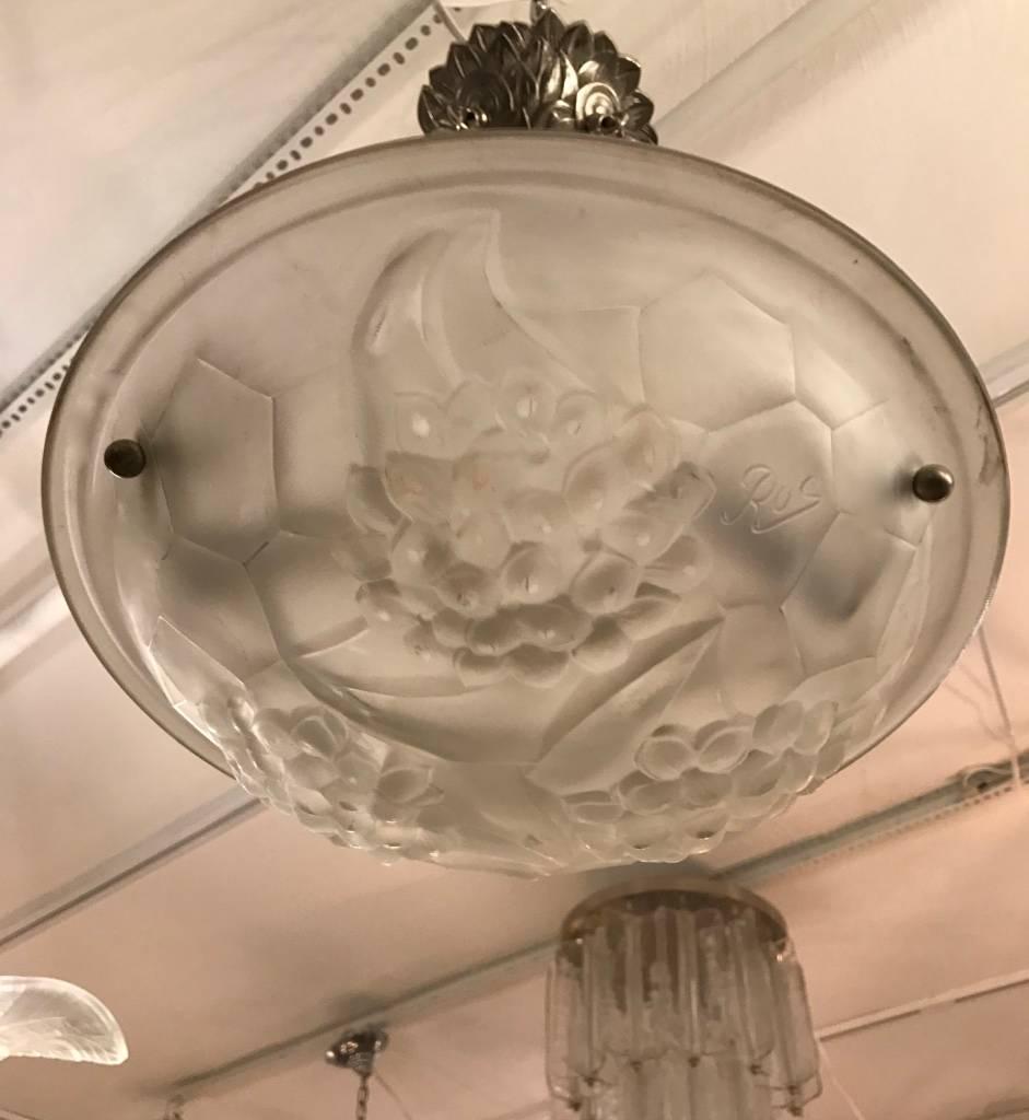 Stunning French Art Deco chandelier signed ROS. With a clear frosted molded glass shades with fruit and geometric motif. Held by three rods with a matching canopy.