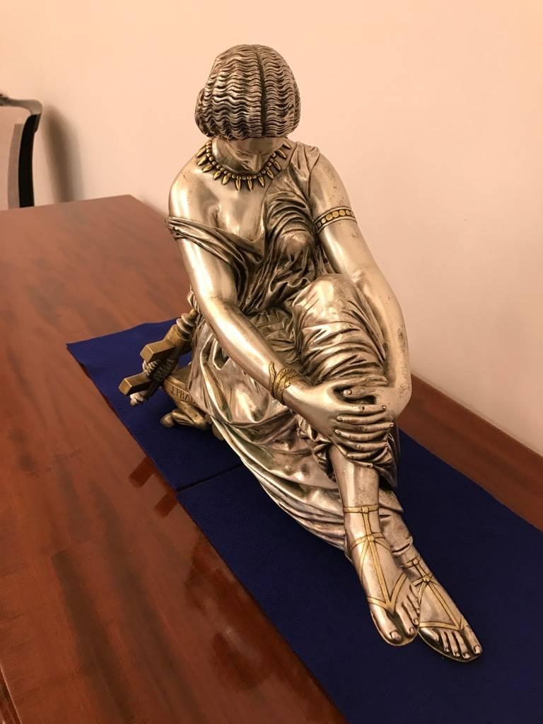 Rare French bronze sculpture of seated female. Signed J. Pradier antique silvered bronze with brass accents.
