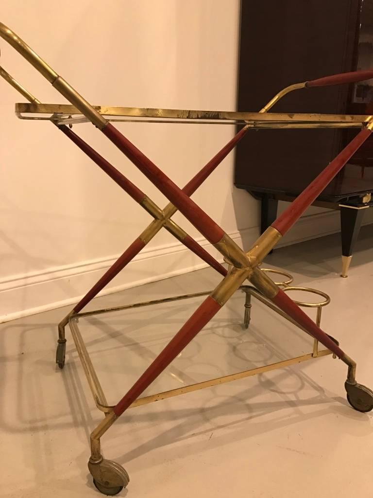 Stunning Italian, Mid-Century bar cart. Having brass and two tiers of glass tops.
