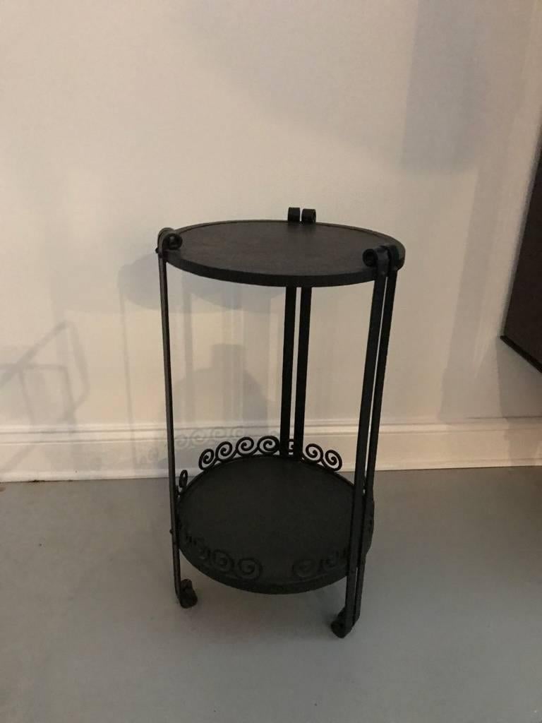 French Art Deco wrought iron side table. Having two tiers with beautiful deco details.