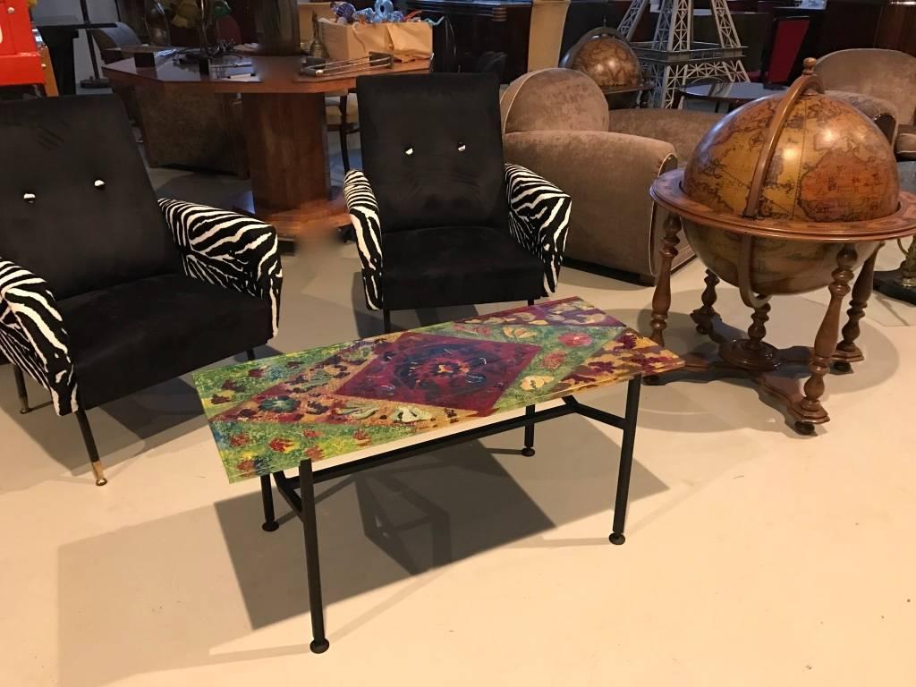 Stunning Mid-Century Italian iron and glass coffee table. With a half inch multi colored glass top, circa 1960s.