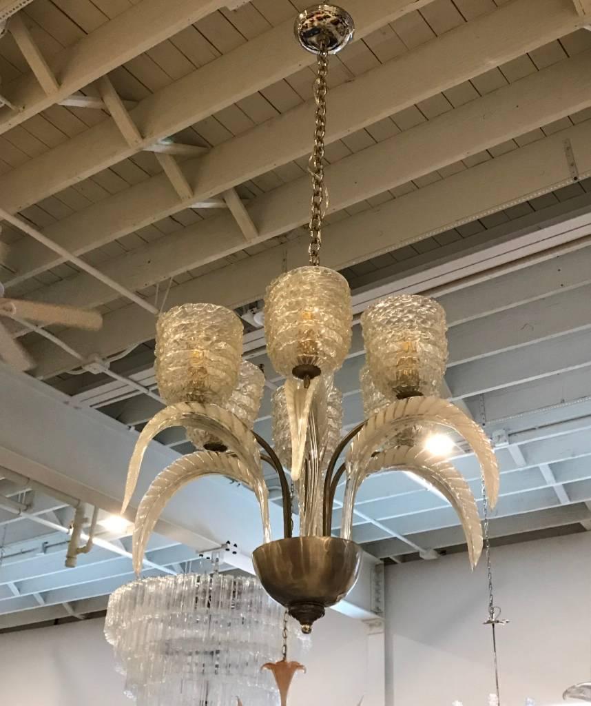 Stunning and elegant Italian Mid-Century Modern chandelier by Barovier e Toso. Having six Murano glass shades with six curved glass leafs. Any amount of chain can be added for custom hanging length. 


Height without chain 25 inches.