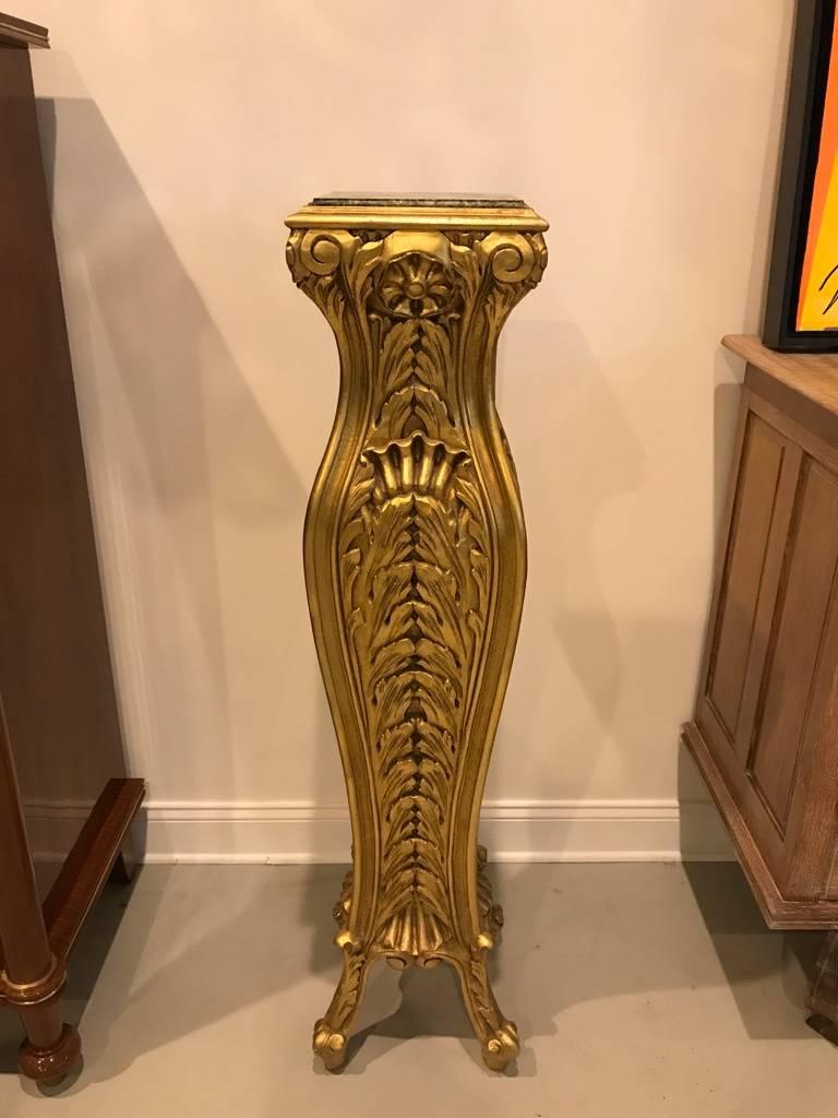 Stunning pair of Mid-Century Modern giltwood pedestals with marble tops. hand-carved giltwood bases. Having green and black marble tops.
