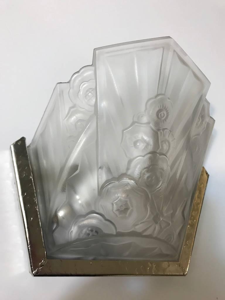 A pair of French Art Deco wall sconces signed by the French artist 