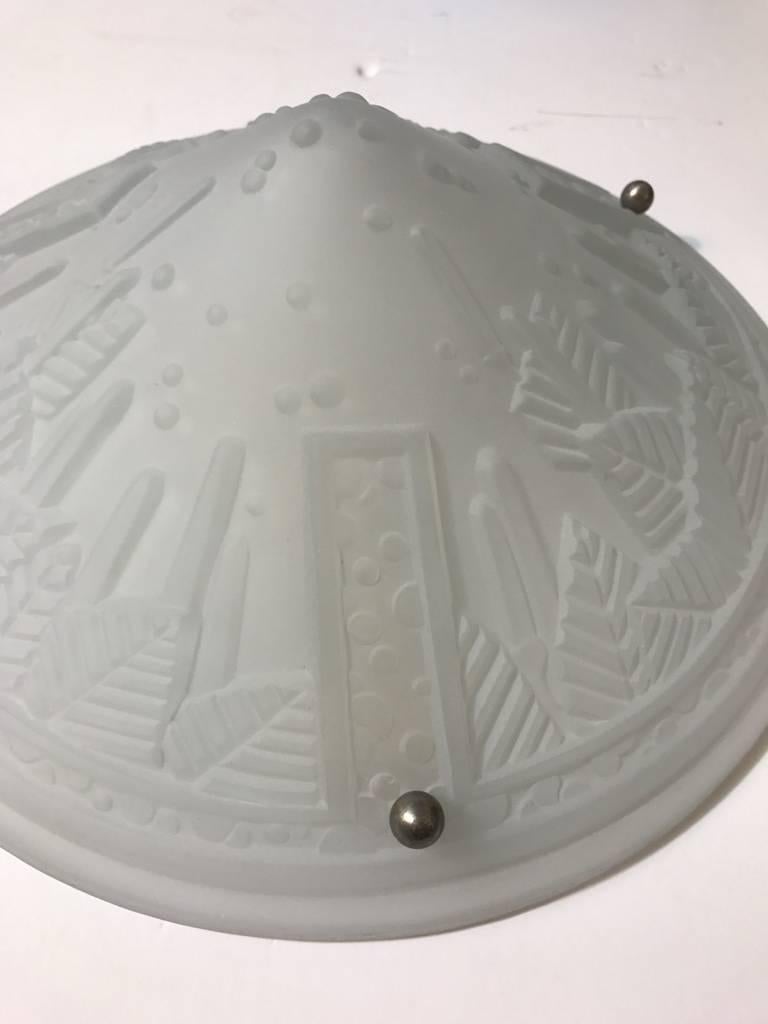 French Art Deco geometric single sconce or flush mount chandelier signed by Muller Freres Luneville. Having frosted glass with over flowing geometric motif details. Supported by three nickel balls. Re-plating upon request.

Dimensions as a single