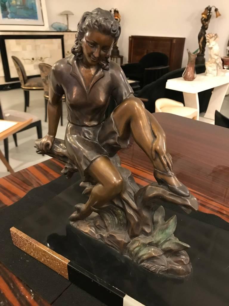 Beautiful Art Deco bronze sculpture of female with swan resting on marble base.