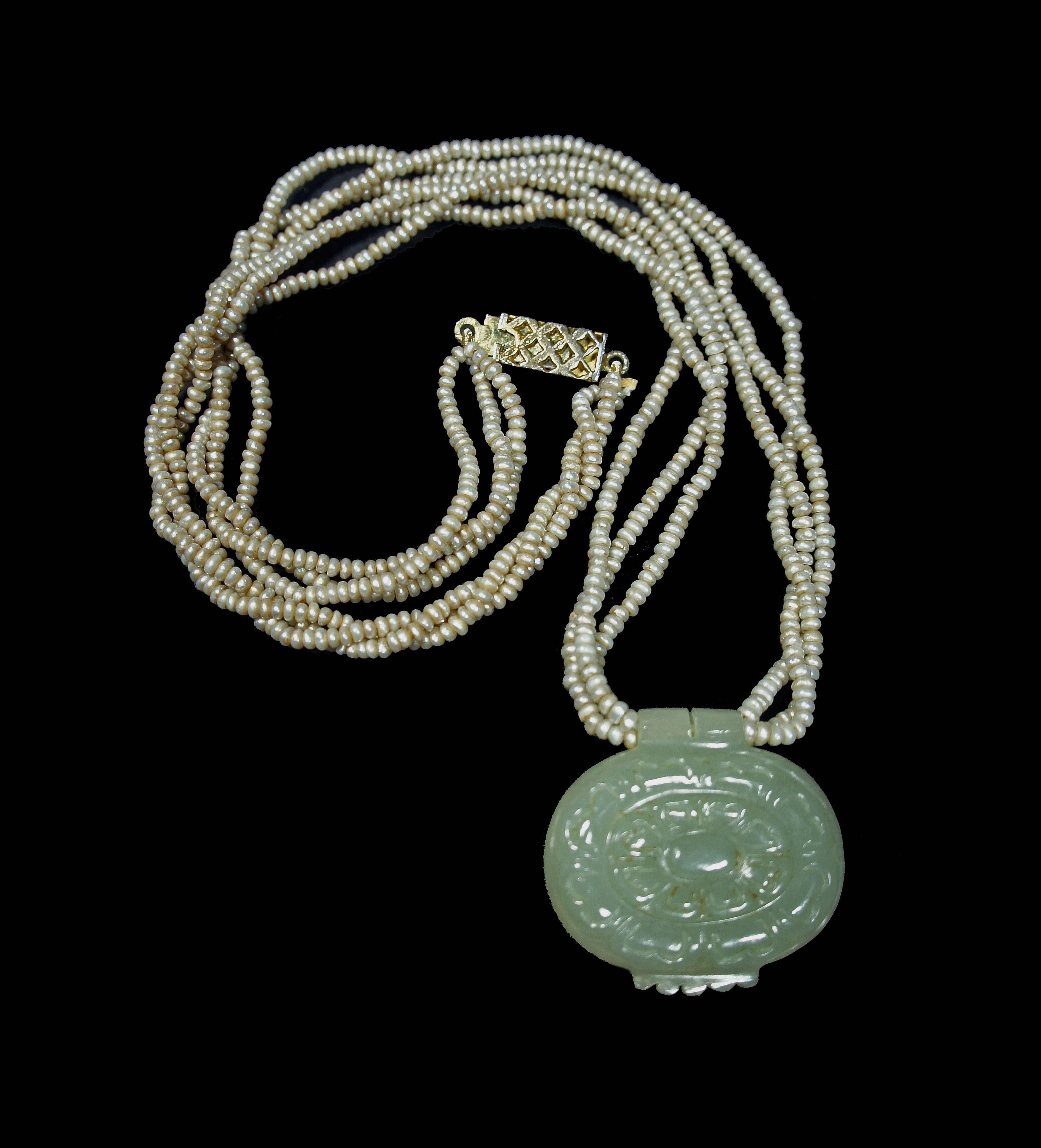 Late 19th-early 20th century Mughal style Khotan light green jade earrings inlaid with diamonds and secured by 22-karat gold outline in kundan technique converted into pendant and strung with new Basara pearls necklace.