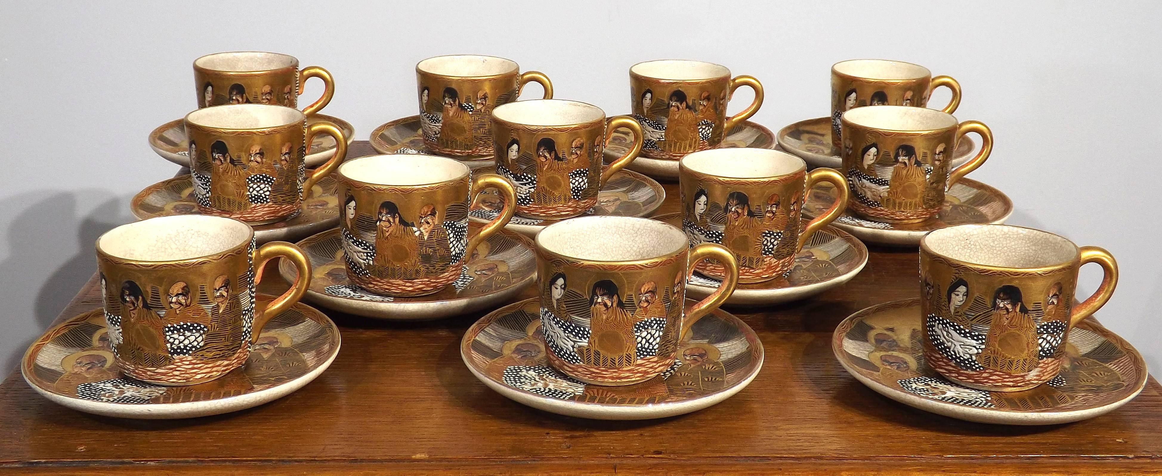 Fine set of highly decorated Satsuma cups and saucers in their original silk lined wooden presentation case. All 24 pieces are undamaged. Box shows signs of wear and is missing it's latch. Silk strap to hold box open is absent.