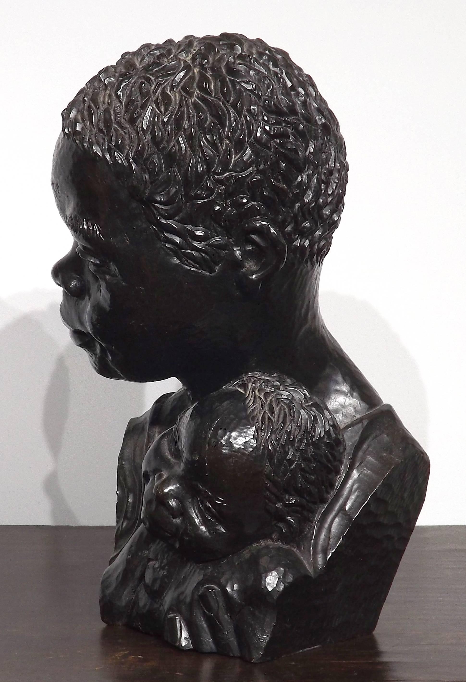 A beautifully carved wooden sculpture by African artist Canaan Chikumbirike. Signed and dated '11-1-1977' on base. Stands 12 1/2 inches tall.

Canaan Chikumbirike was born with his younger twin brother on the 7th of October 1954 to a farming