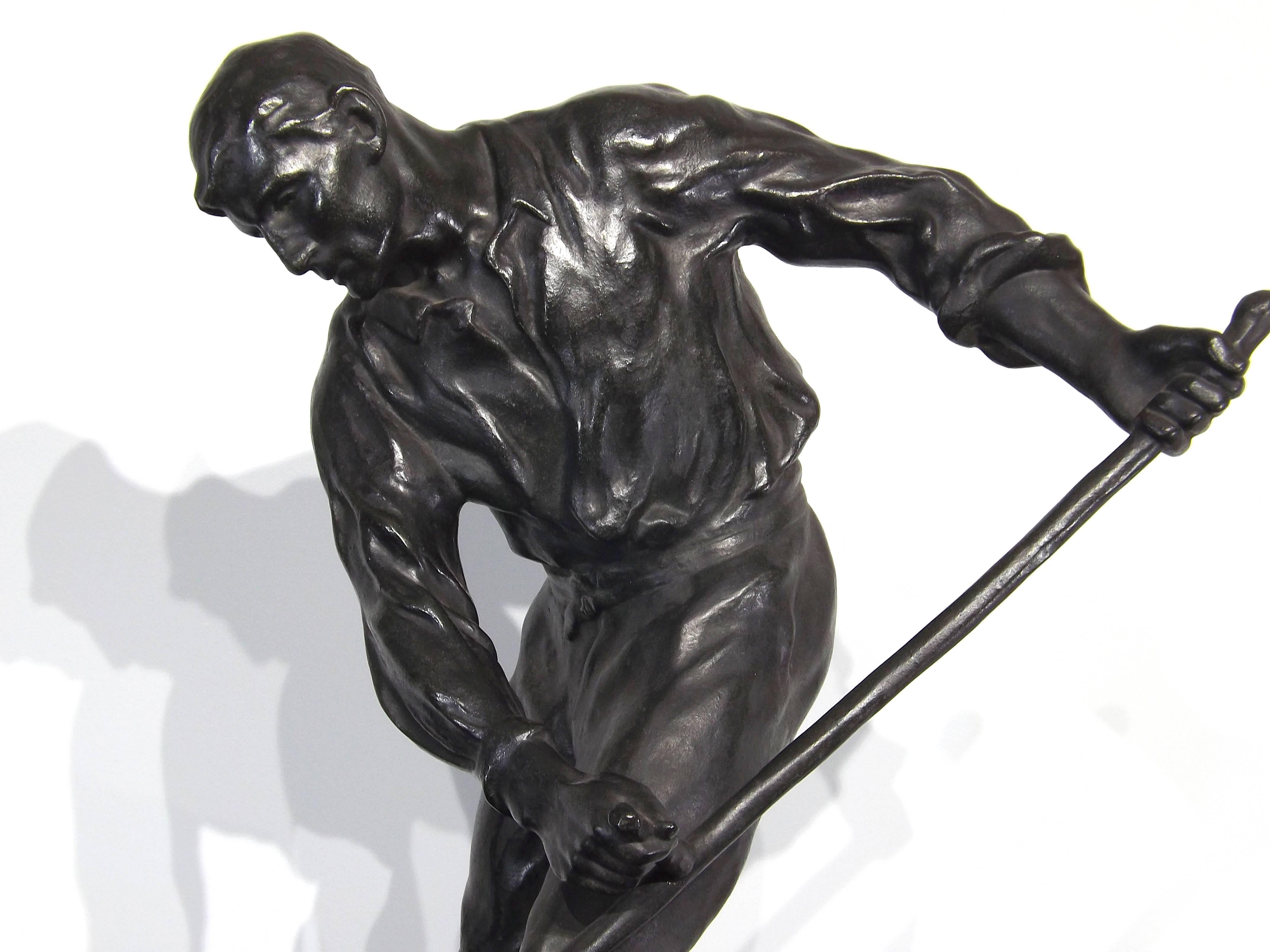A nicely cast original bronze by Belgian sculptor Oscar De Beul depicting a field worker cutting grain with his scythe.