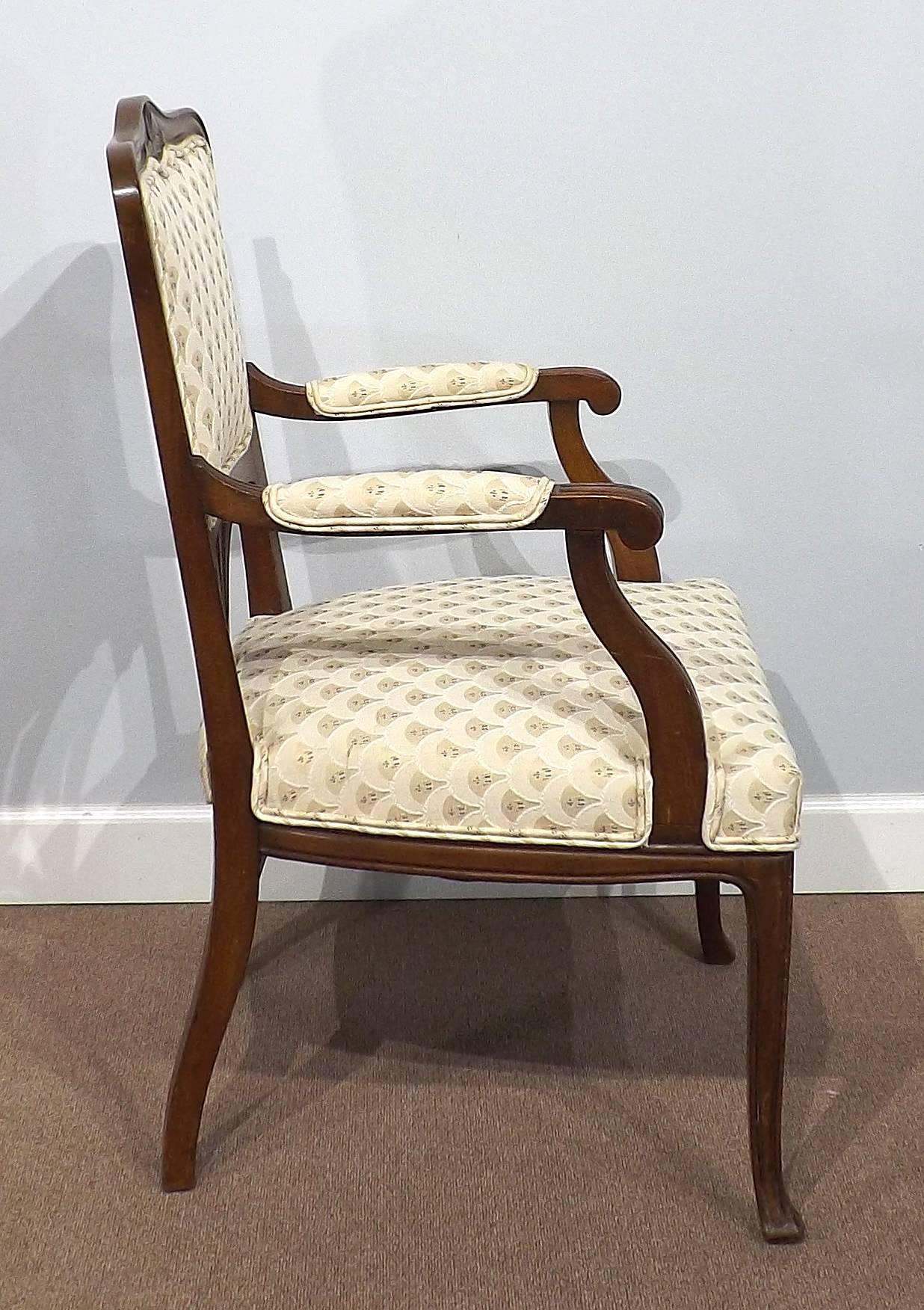 An elegantly carved Art Nouveau chair made by the well know Dutch furniture maker Pander, circa 1900. Newly upholstered in period-style fabric.