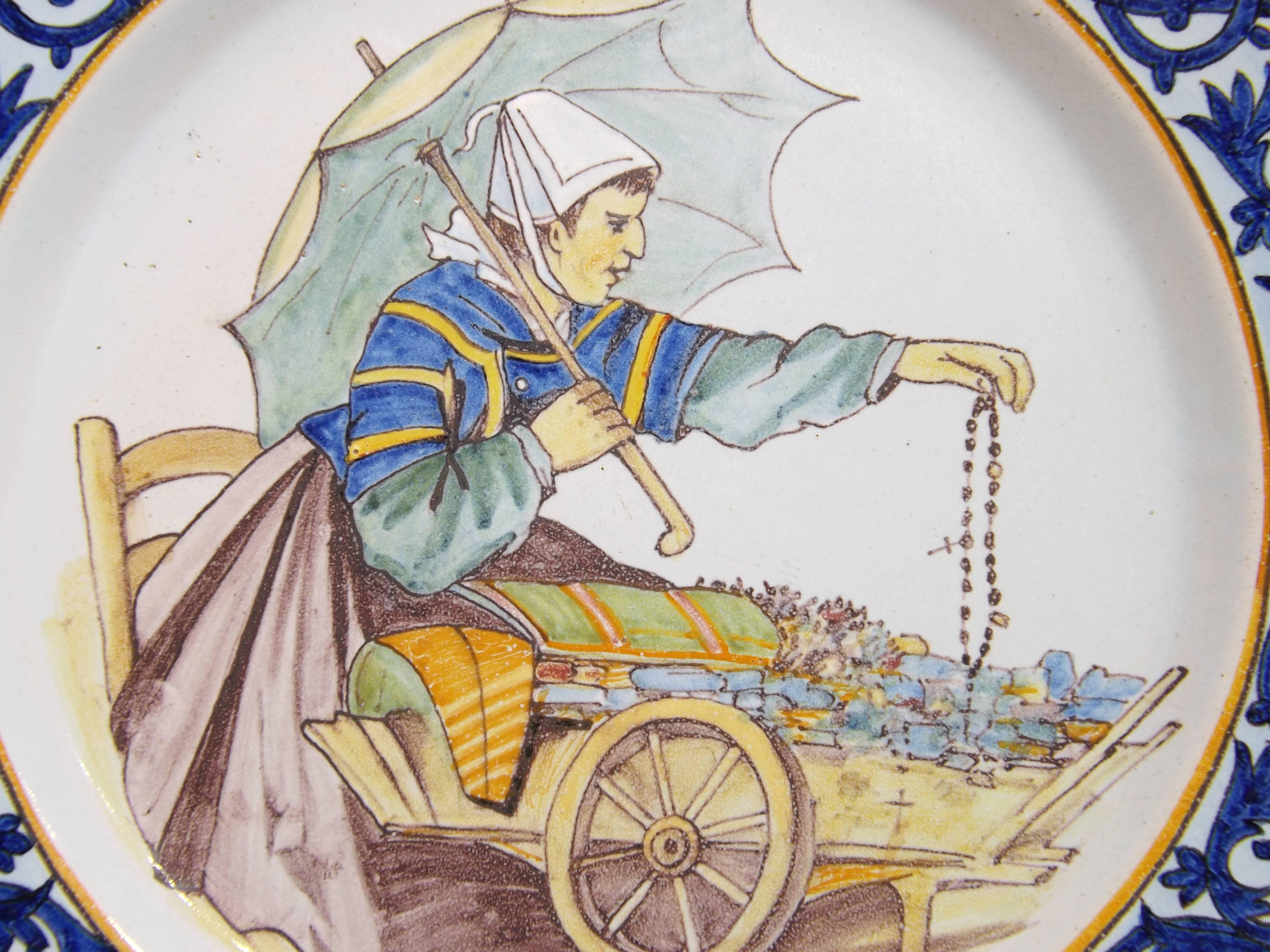 Beautifully painted Quimper plate with decor riche border and coat-of-arms. Porquier-Beau (PB) mark from the, early 1900s.