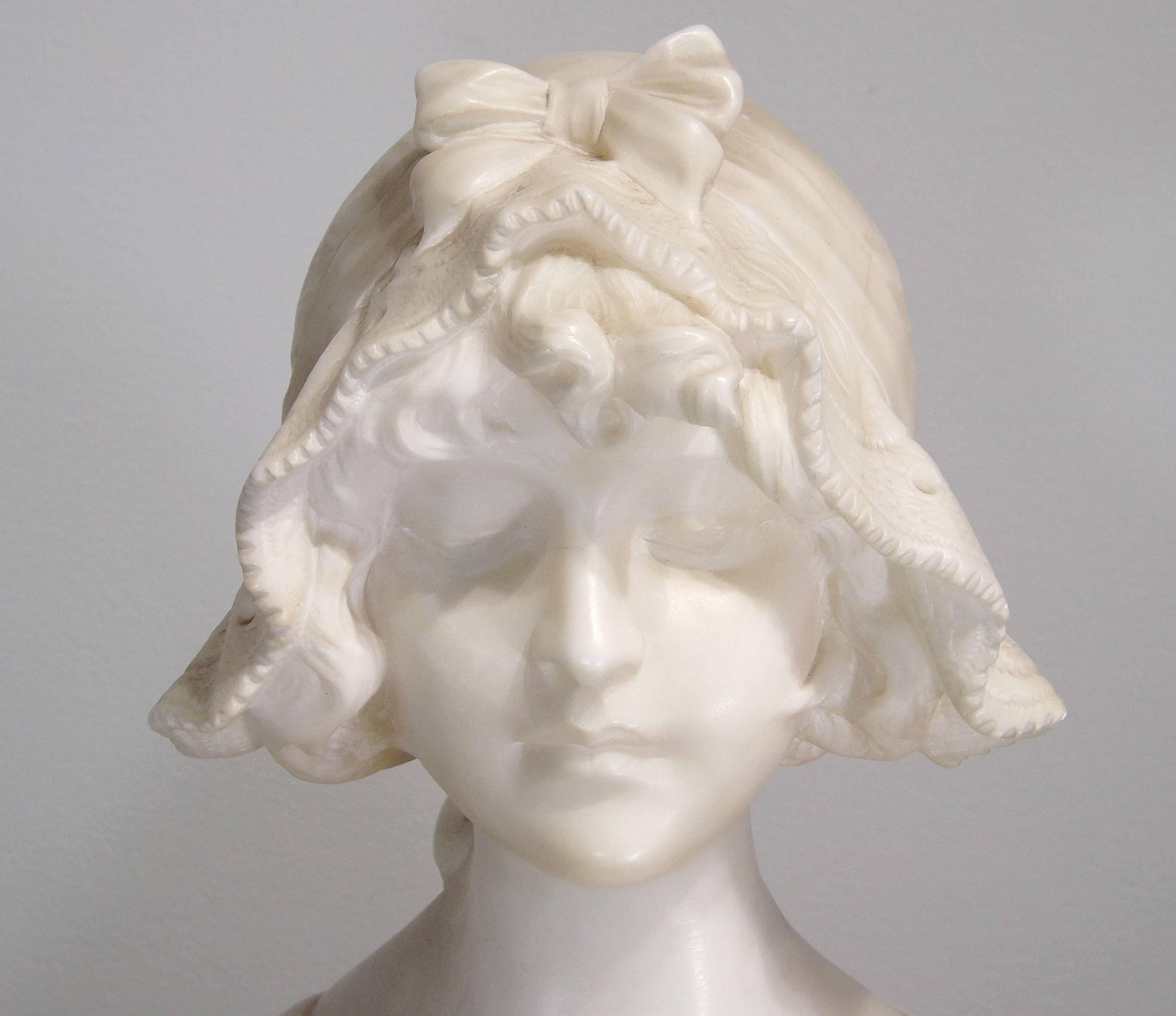 A wonderful bust of a young lady with a lace cap, her eyes cast demurely downward. Very little is known of the European sculptor Anton Nelson, presumably due to his very short life (born 1880, died 1910). Signed on back, lower left side.