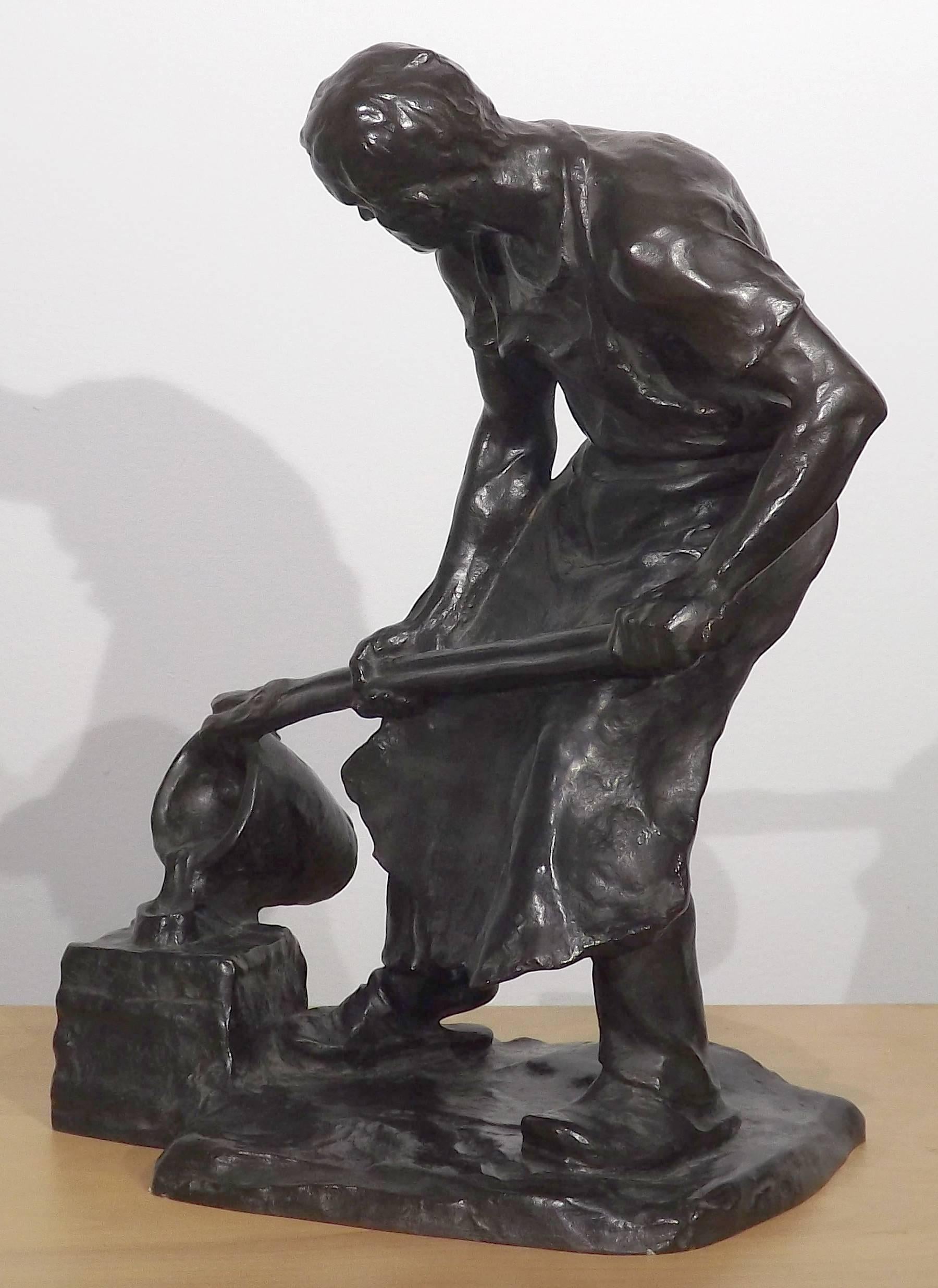 A handsome bronze of a foundry worker slowly pouring hot molten metal into a cast, expertly sculpted by Austrian sculptor Hans Muller (1873-1937). Great detail was given to this work, from the intense concentration on the face of the worker to the