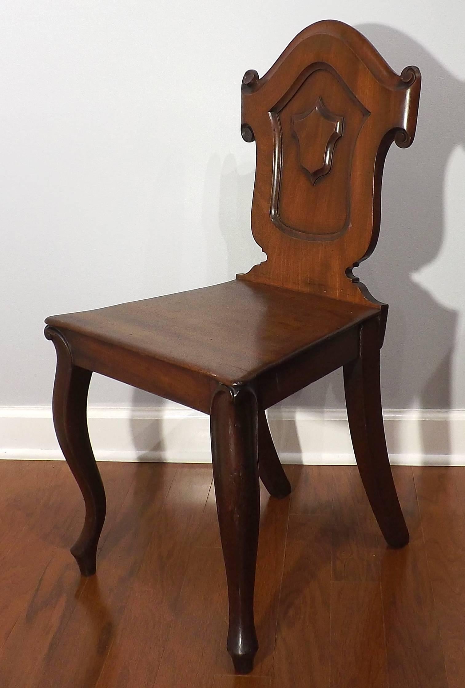 A charming and very sturdy Biedermeier chair, suitable for a small child or a doll collection. Finely crafted of mahogany with dowelled construction.