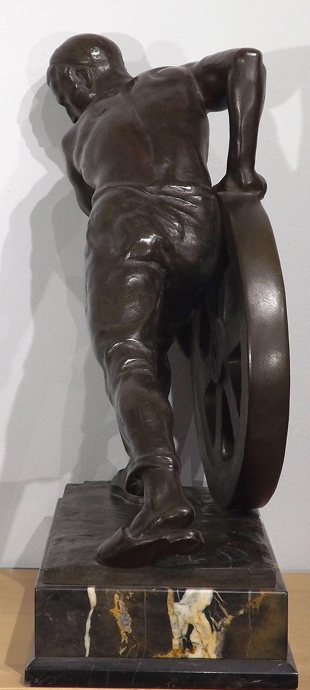 Bronze of a Man Pushing a Wheel by Ernst Seger For Sale 2