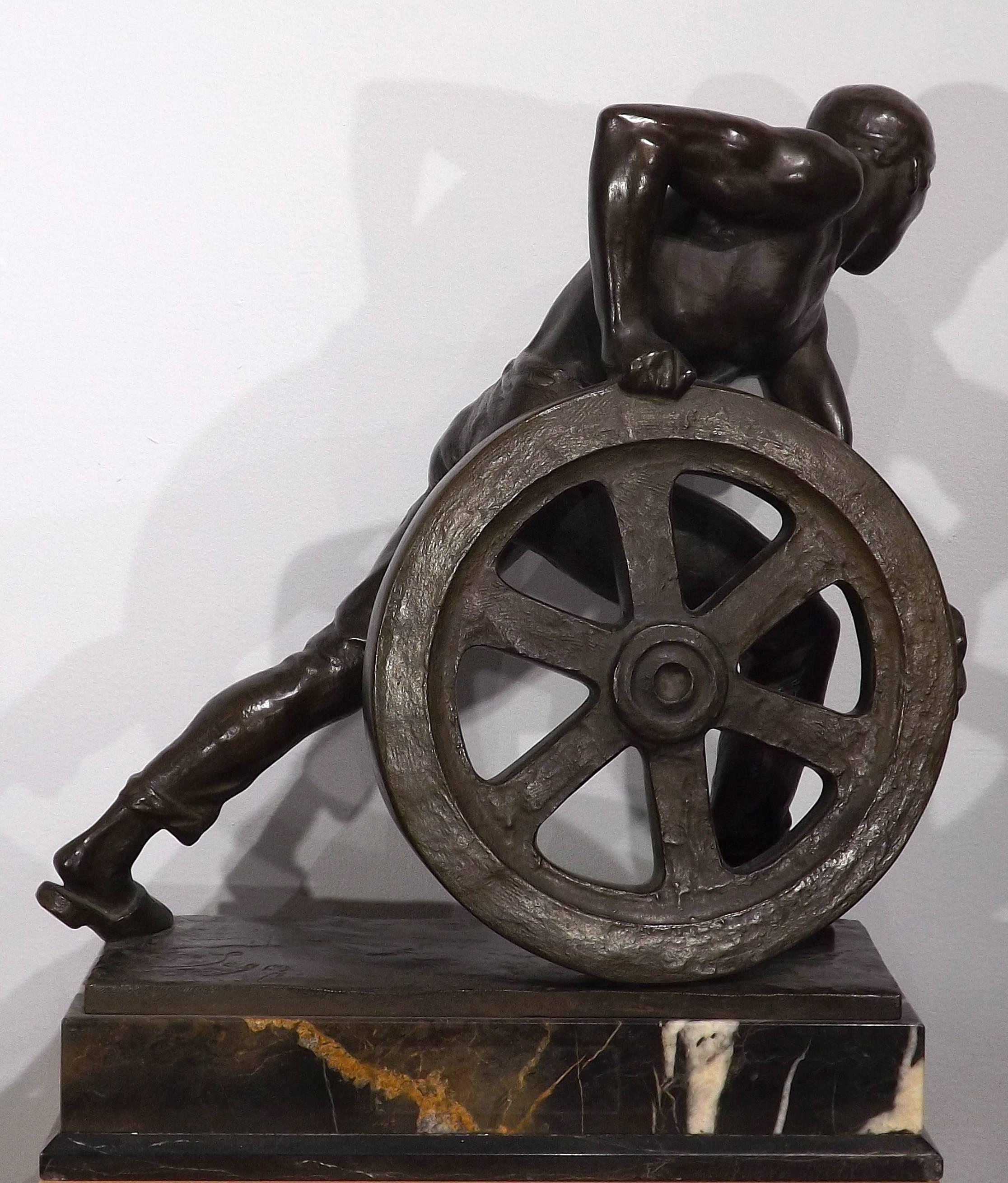 20th Century Bronze of a Man Pushing a Wheel by Ernst Seger For Sale