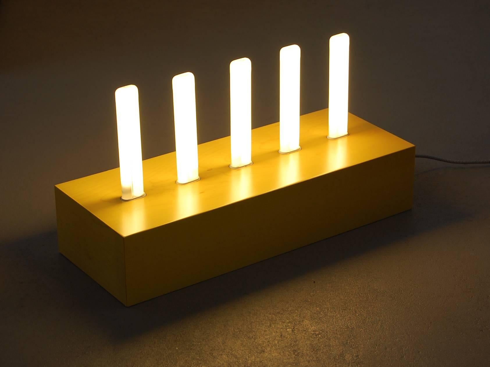 Ettore Sottsass
Post design (Memphis), Milan, Italy.

‘Pattica’ lamp, 2000.

Yellow dyed maple base with five florescent lamps.
Original box.

Fully function, supplied complete with all light bulbs.

As much a work of art as it is a lamp, this can