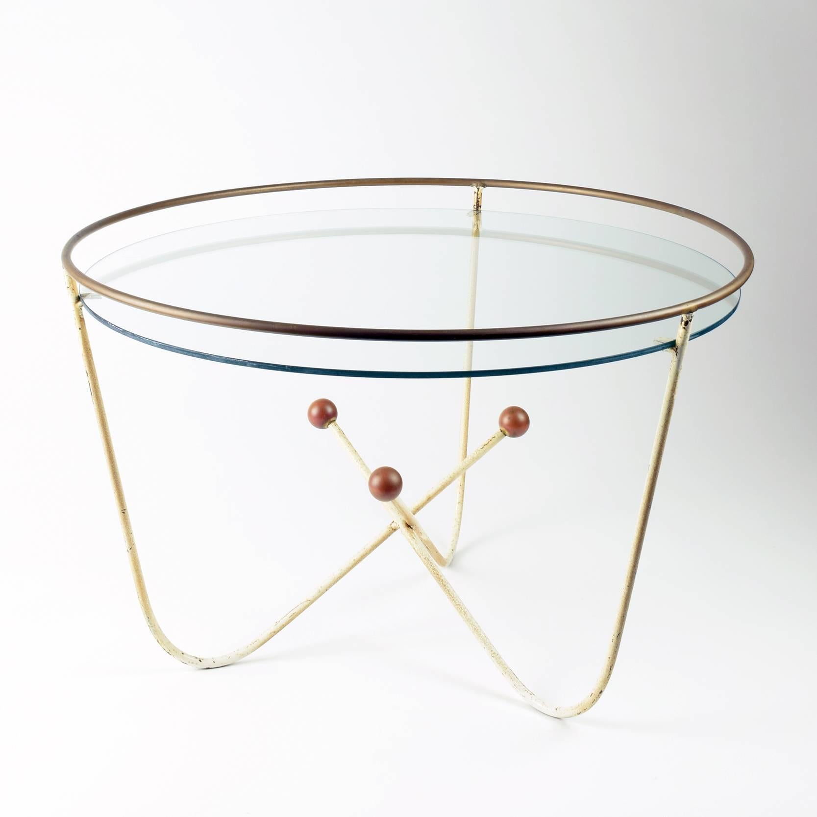 Edward Ihnatowicz, coffee/side table for Mars Furniture, retailed by Heals, 1950s.

This pretty little Mid-Century, 1950s low table is typical of the 1951 festival of Britain style championed by British designers such as Ernest Race.

Painted metal