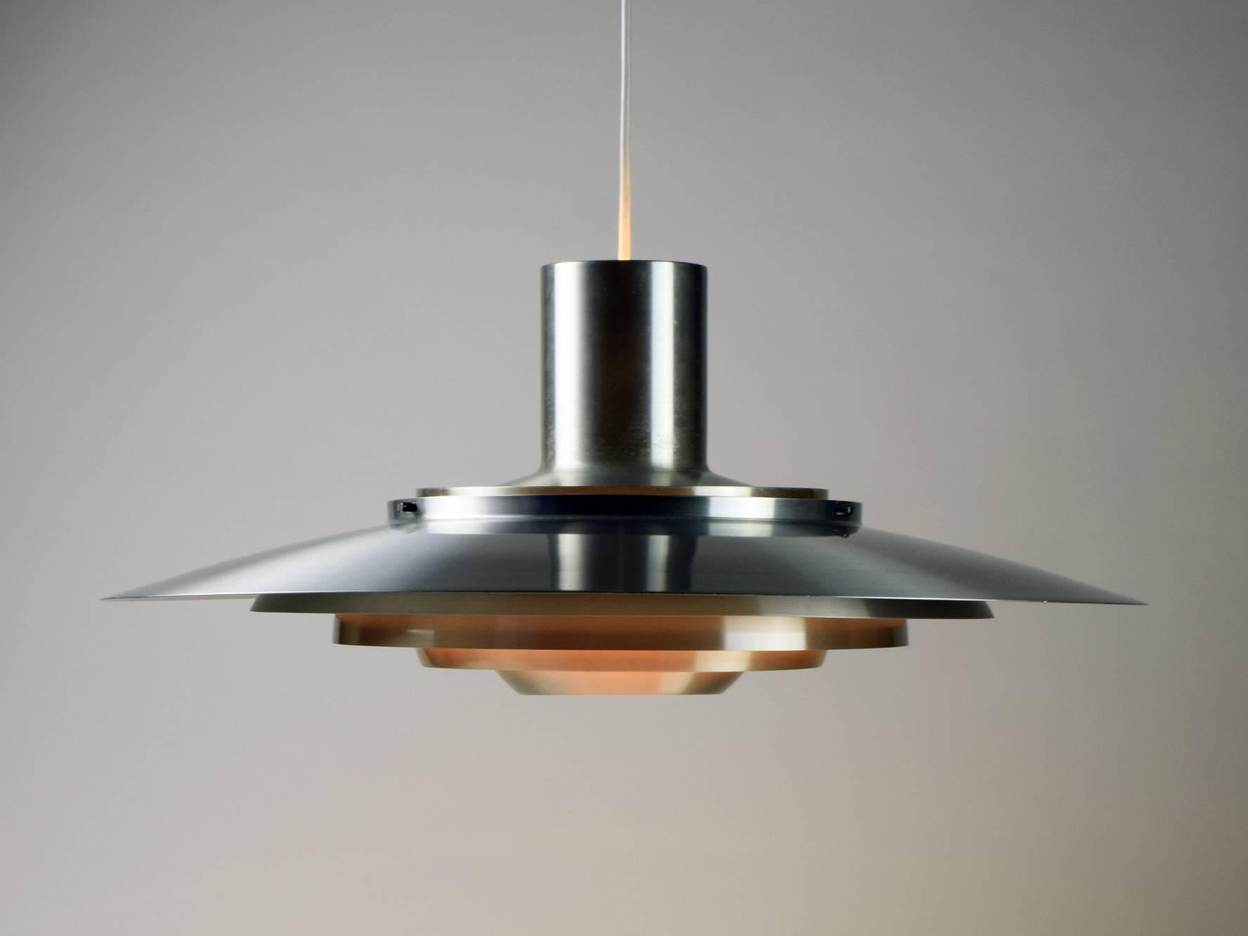 Jørgen Kastholm & Preben Fabricius.
Nordisk Solar, Denmark (manufacturer).
Extra large pendant ceiling lamp, 1960s.

Aluminium. Good original condition with some surface patina.
Fully re-wired, compete with white ceiling cap and spare light