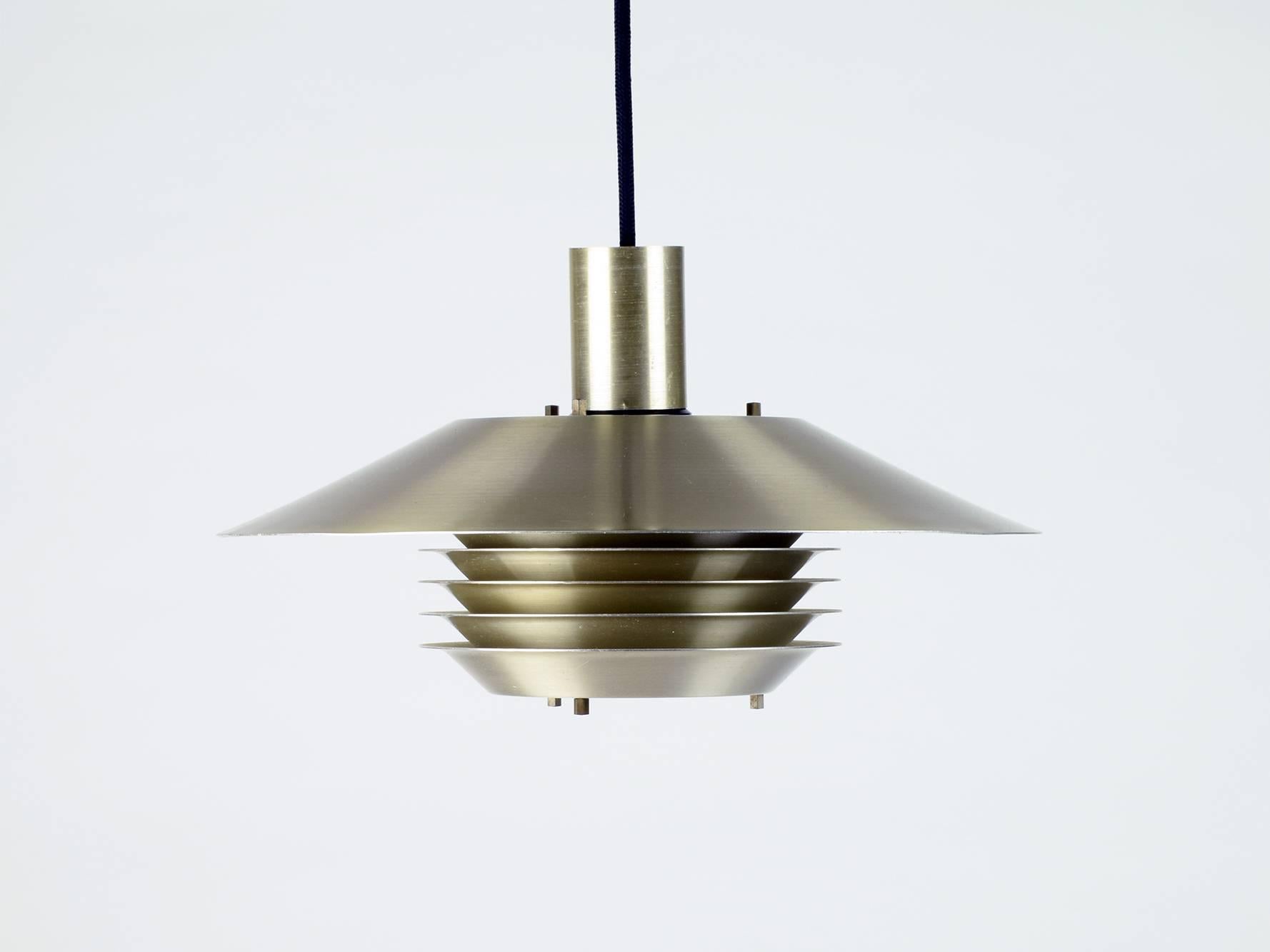 Jo Hammerborg (attributed).
Fog & Mørup (manufacturer), Denmark.
Ceiling pendant, 1960s.
Brass finish metal.

Attributed to Jo Hammerborg for Fog & Mørup because of the very similar style and technique of other lamp designs by this designer and