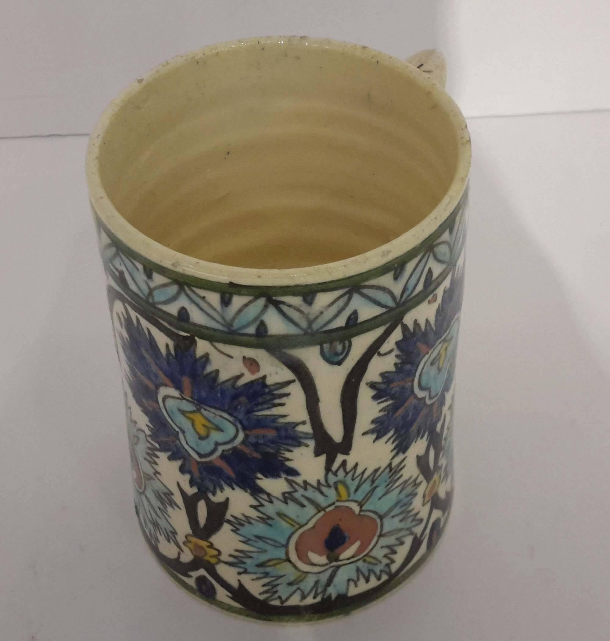 Soft paste ceramic mug. With hand-painted enamel Iznik decorations.