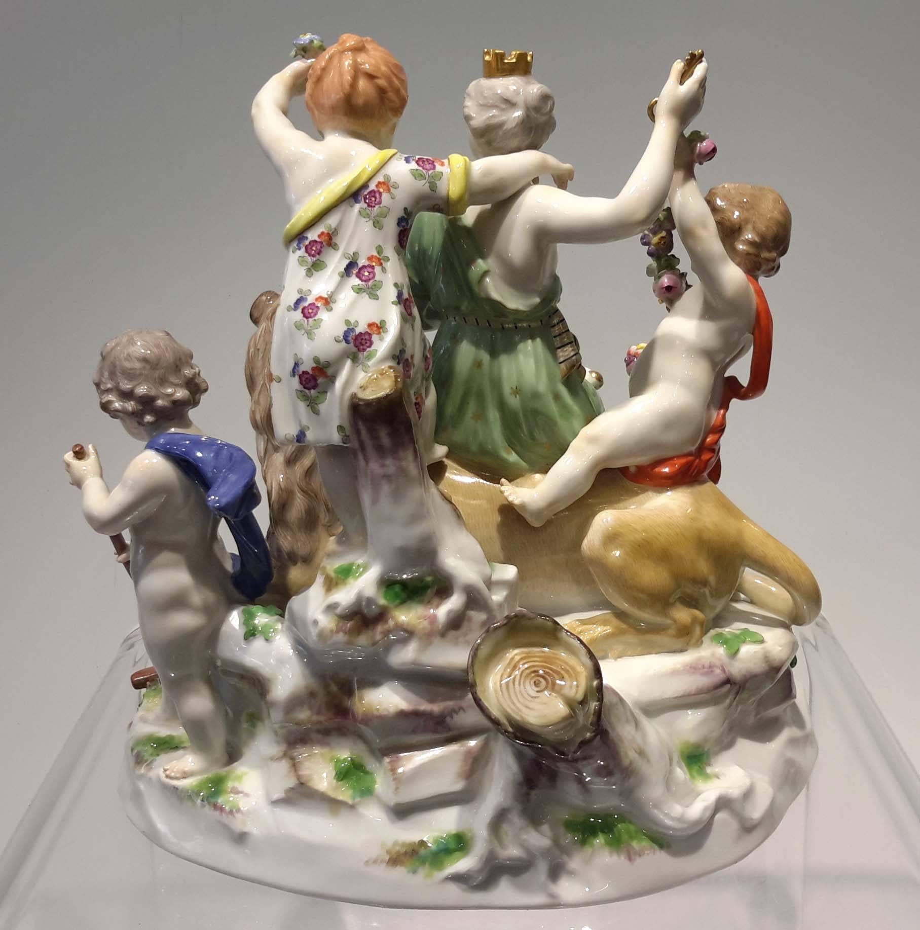 First quality Meissen porcelain. Bearing underglazed crossed swords mark.
Emblematic of Earth, the crowned goddess seated on a lion, holding a cornucopia and a key and attended by four putti.